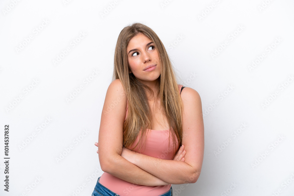 Young caucasian woman isolated on white bakcground making doubts gesture while lifting the shoulders Young caucasian woman isolated on white bakcground making doubts gesture while lifting the shoulders
