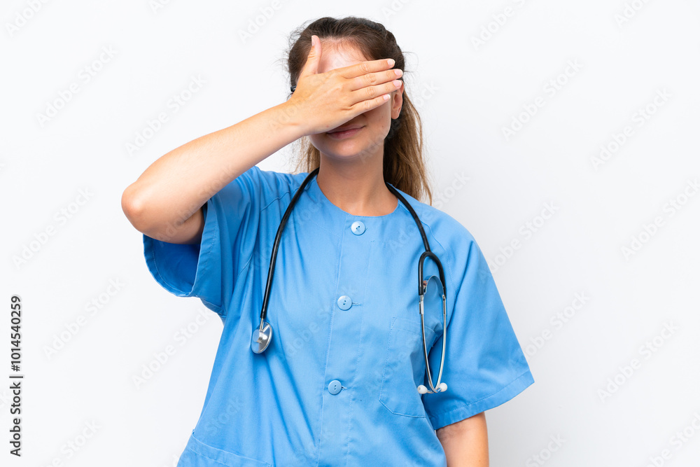 Young nurse doctor woman isolated on white background covering eyes by hands. Do not want to see something Young nurse doctor woman isolated on white background covering eyes by hands. Do not want to see something