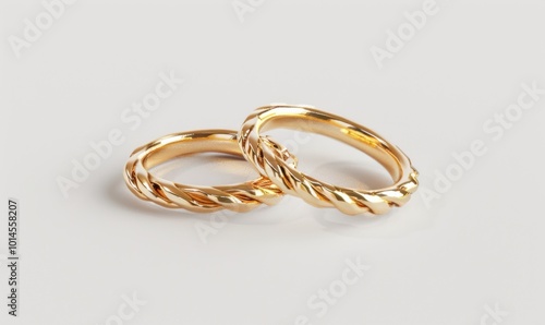 Pair of gold wedding rings, white background, 4K hyperrealistic photo