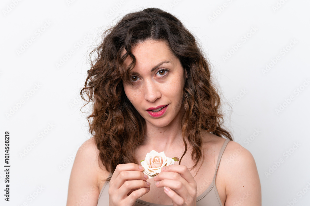 Young caucasian woman isolated on white background holding flowers. Close up portrait Young caucasian woman isolated on white background holding flowers. Close up portrait