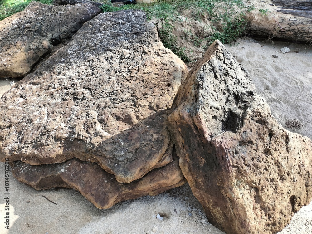 Fototapeta premium Natural stone piles with beach sand