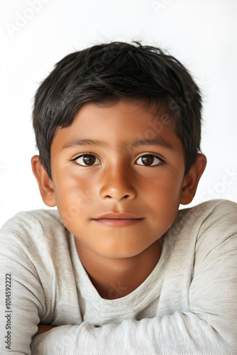 portrait of smiling hispanic boy isolated on white