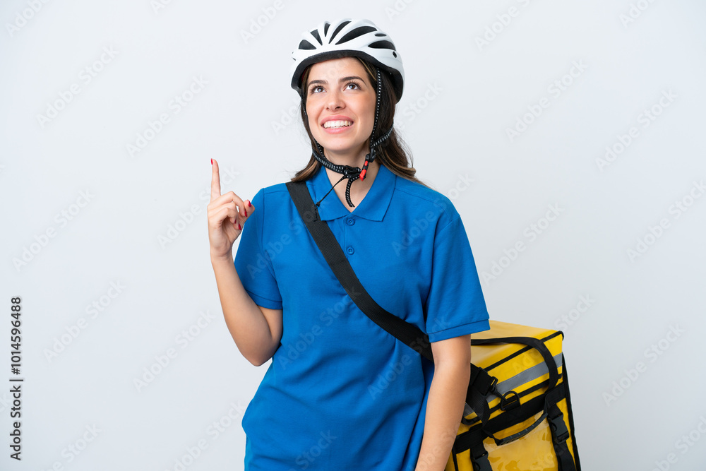 Young delivery woman with thermal backpack isolated on white background pointing up and surprised Young delivery woman with thermal backpack isolated on white background pointing up and surprised
