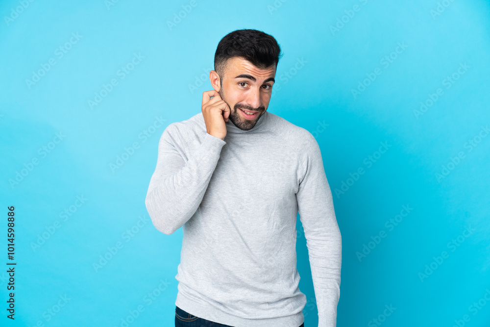 Caucasian man over isolated blue background laughing Caucasian man over isolated blue background laughing