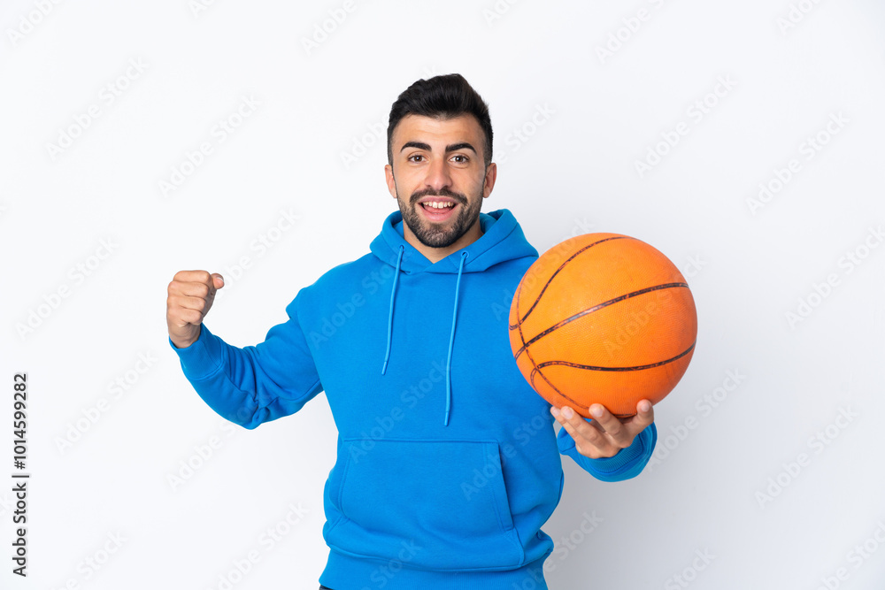 Caucasian man over isolated white background playing basketball