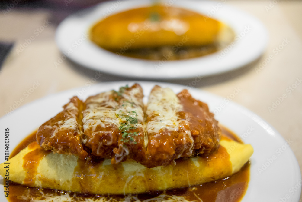 omu rice, omelette with rice with fried pork or tonkatsu, curry sauce. japanese food omu rice, omelette with rice with fried pork or tonkatsu, curry sauce. japanese food