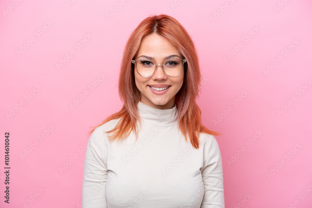 Young Russian girl isolated on pink background With glasses with happy expression Young Russian girl isolated on pink background With glasses with happy expression