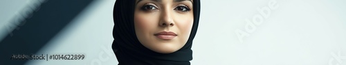 Young woman in stylish hijab posing confidently indoors