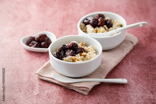 Homemade pudding with warm cherries and coconut photo