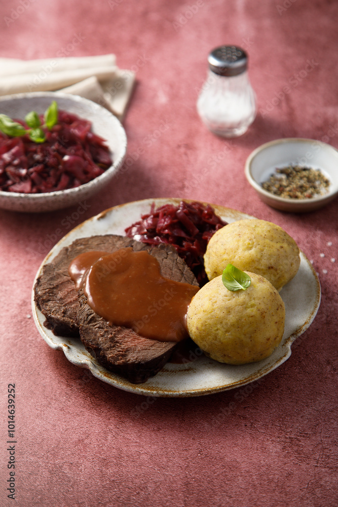 Roasted meat with red cabbage and potato dumplings Roasted meat with red cabbage and potato dumplings