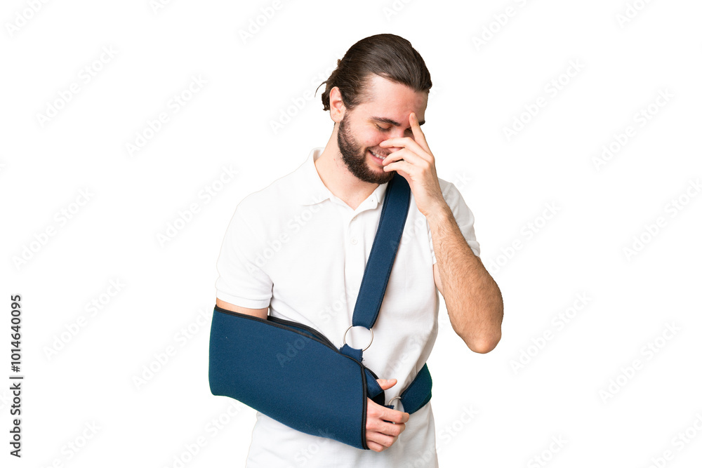 Young handsome man with broken arm and wearing a sling over isolated chroma key background laughing Young handsome man with broken arm and wearing a sling over isolated chroma key background laughing