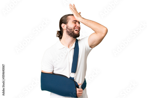 Young handsome man with broken arm and wearing a sling over isolated chroma key background has realized something and intending the solution