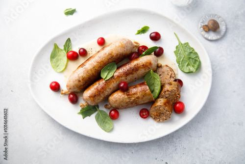 Homemade sausages with spinach and cranberry