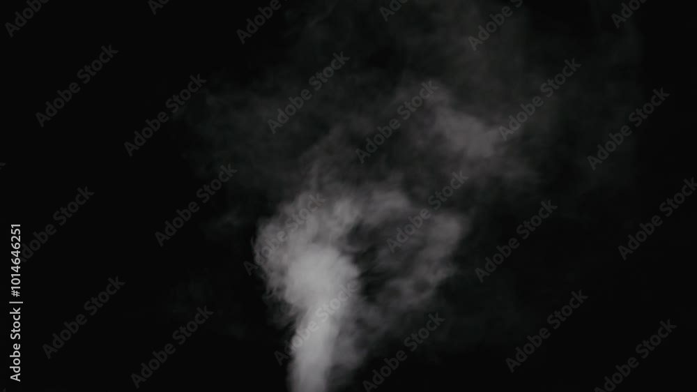 Slow motion water mist stream with wind effect over black background Slow motion water mist stream with wind effect over black background