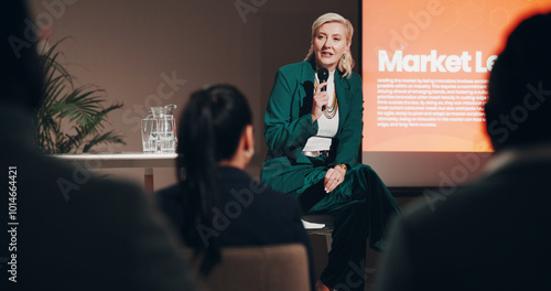 Photos Mature woman, stage and seminar with microphone for leadership skills, information or knowledge