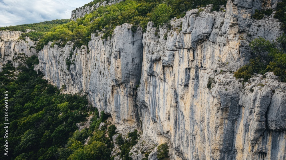 Towering cliffs made of limestone, eroded by wind and rain over centuries Towering cliffs made of limestone, eroded by wind and rain over centuries