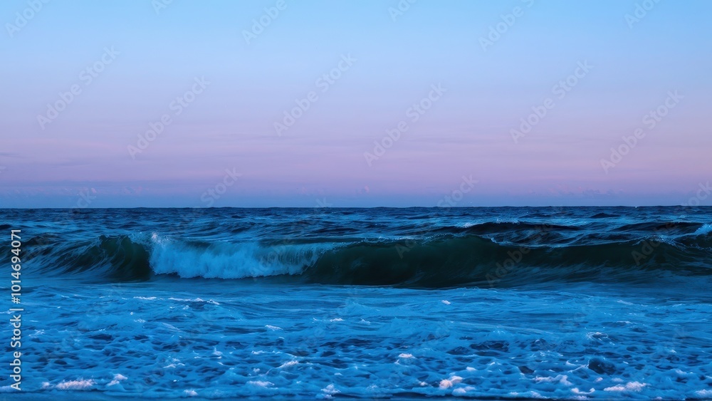 A serene ocean scene at dusk with waves gently crashing against the shore. A serene ocean scene at dusk with waves gently crashing against the shore.