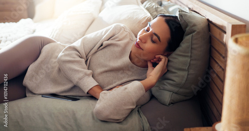 Woman, tired and sleeping on bed for nap, comfortable and afternoon relax with peace, quiet and dream. Female person, fatigue and rest in home on weekend for chill, break and calm with relief or cozy photo