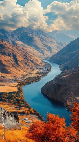 Serene river valley winding through autumnal landscapes at sunset