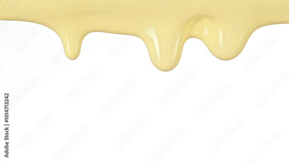 Super Slow Motion Detail Shot of Slowly Dripping Fresh Vanilla Cream Isolated on White at 1000fps. Super Slow Motion Detail Shot of Slowly Dripping Fresh Vanilla Cream Isolated on White at 1000fps.
