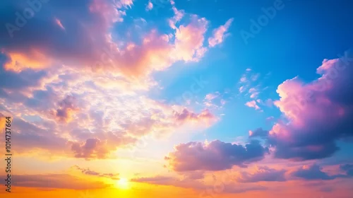 Obraz Na horyzoncie rozgrywa się spektakularny zachód słońca, malując niebo w intensywnych odcieniach pomarańczu, różu i fioletu.