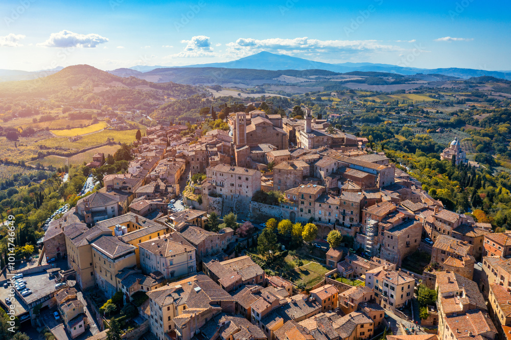 Naklejka premium Village of Montepulciano with wonderful architecture and houses. A beautiful old town in Tuscany, Italy. Aerial view of the medieval town of Montepulciano, Italy