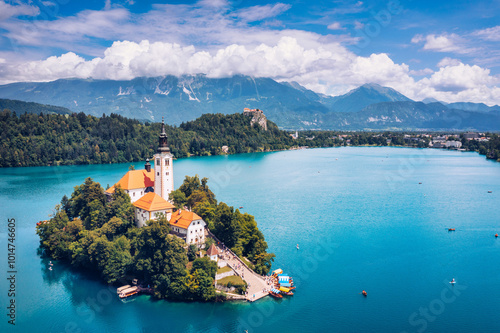 Lake Bled in Slovenia. Beautiful mountains and Bled lake with small Pilgrimage Church. Bled lake and island with Pilgrimage Church of the Assumption of Maria. Bled, Slovenia, Europe. photo