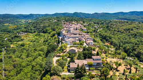 View of Venasque village with old church Notre Dame de Vie to landscape of Luberons, Provence, France. Beautiful Church and houses in the town of Venasque, Provence, France. photo