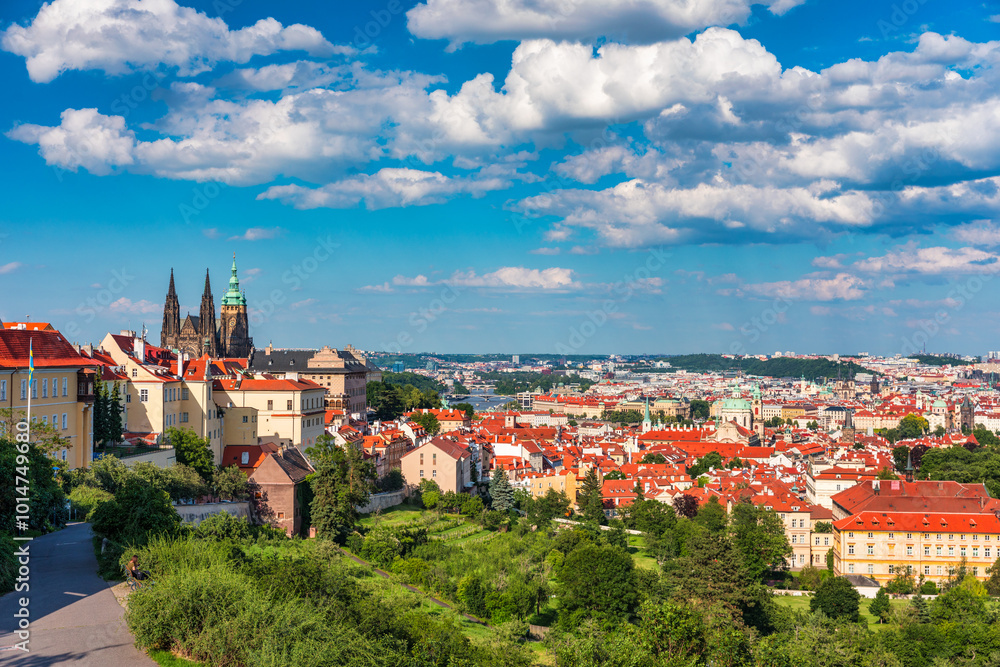 View of Prague featuring historic castle and vibrant rooftops on a sunny day in summer. Aerial view of Prague, Charles Bridge over Vltava river in Prague, Czechia. Old Town of Prague, Czech Republic. View of Prague featuring historic castle and vibrant rooftops on a sunny day in summer. Aerial view of Prague, Charles Bridge over Vltava river in Prague, Czechia. Old Town of Prague, Czech Republic.