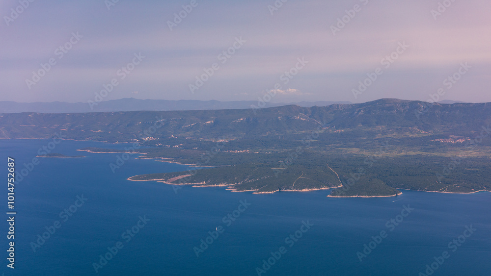 View on mountains and sea from Vidova Gora on Brac island. View from the mountain Vidova Gora on the island Brac in Croatia with the famous landmark Zlatni Rat near the city of Bol an the blue sea. View on mountains and sea from Vidova Gora on Brac island. View from the mountain Vidova Gora on the island Brac in Croatia with the famous landmark Zlatni Rat near the city of Bol an the blue sea.