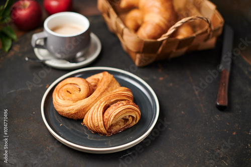 Franzbrötchen an original sweet pastry from Hamburg with a cup of latte