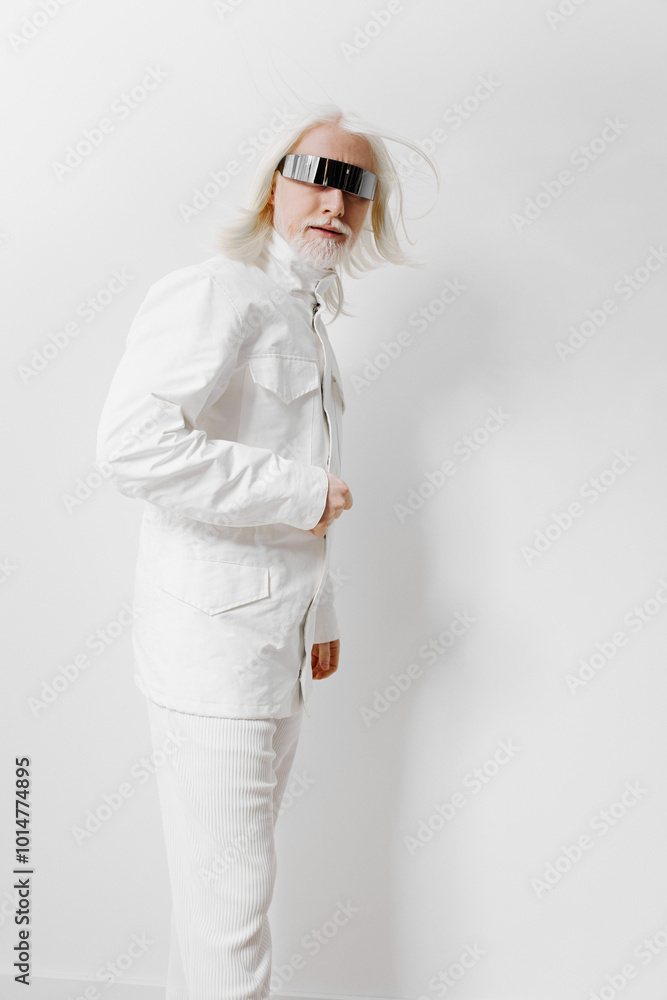 Futuristic man in a white outfit with sunglasses standing against a minimalistic white background, embodying a modern and stylish concept with a unique fashion sense Futuristic man in a white outfit with sunglasses standing against a minimalistic white background, embodying a modern and stylish concept with a unique fashion sense
