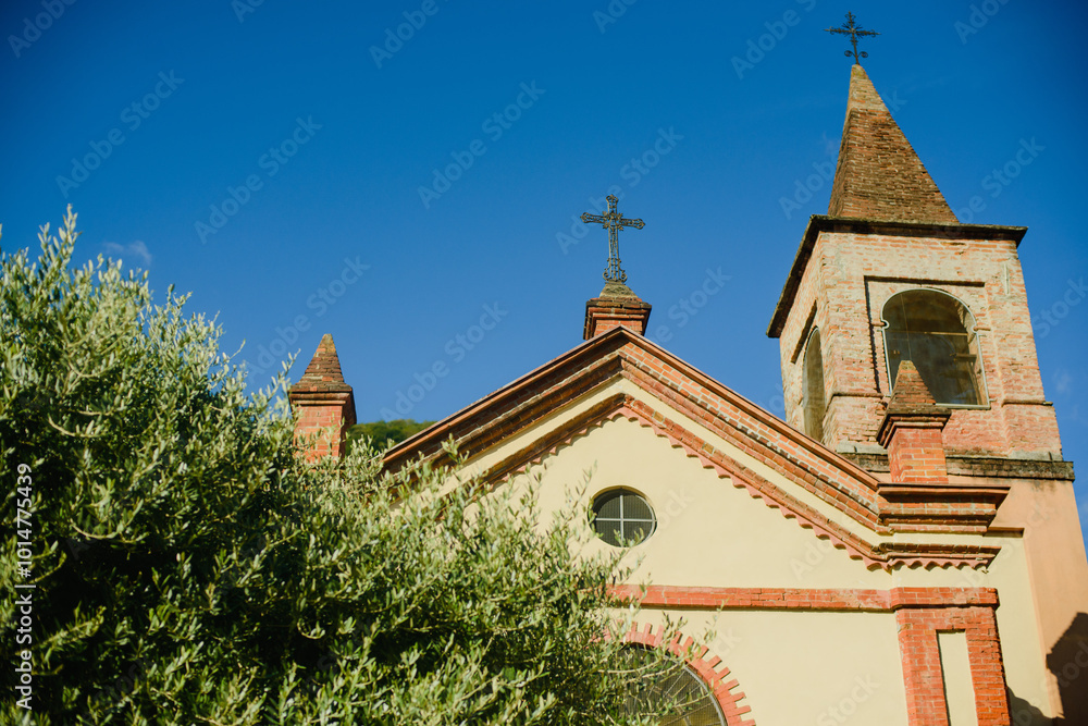 Fototapeta premium The facade of the Catholic Church in the old city of Europe. Northern Italy