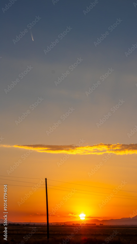 Sunset with plane and open sky, ideal for text overlays and vertical wallpapers. Sunset with plane and open sky, ideal for text overlays and vertical wallpapers.