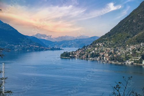 Como city in Italy, view of the city from the lake, with mountains in background 