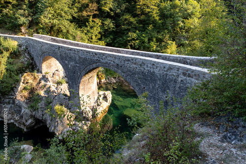 Old brick arch bridge called Danilov most at Mrtvica canyon in Montenegro