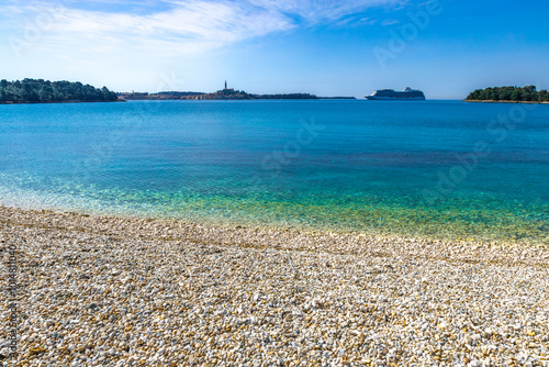 A huge tourist ship enters the port of Rovinj, sailing on the Adriatic Sea on a cruiser photo