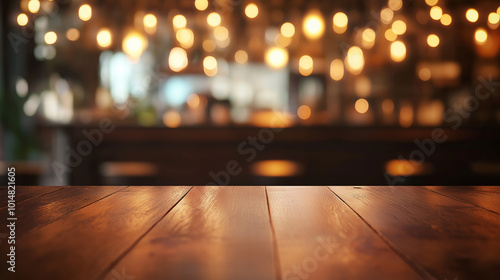 Polished wooden table with bokeh lights in cozy interior. Warm ambient lighting background for restaurant, café, or bar design. Rustic wooden surface with glowing blurred lights for product display