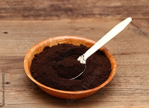 Coffee grounds in a bowl as natural organic fertilizer. Organic and cheap way how to manure plants and flowers.