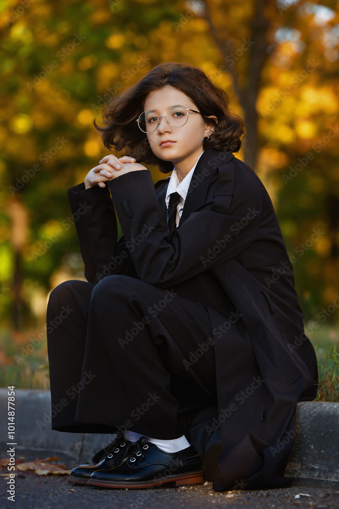 portrait of girl in glasses in black raincoat in afternoon in an autumn park, autumn theme, autumn background with girl portrait of girl in glasses in black raincoat in afternoon in an autumn park, autumn theme, autumn background with girl