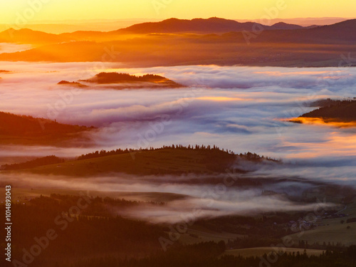 Sunrise Over Misty Hills and Valleys