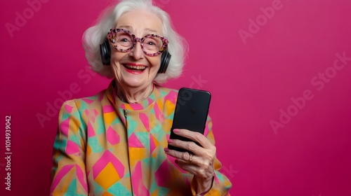 Cheerful Elderly Woman Using Smartphone in Colorful Studio Setting