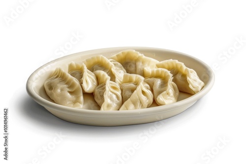 A traditional Asian-style meal setup featuring a white bowl filled with steaming hot dumplings and served on a table