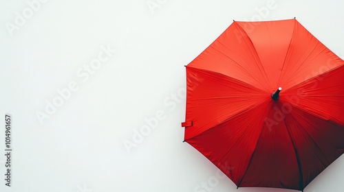 A vibrant red umbrella opened wide on a clean white background, symbolizing warmth and protection, ideal for seasonal marketing campaigns.