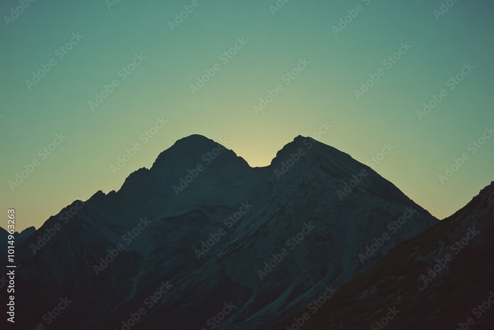 Plane flying over mountains at sunset Plane flying over mountains at sunset