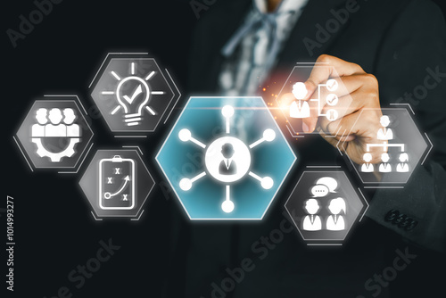 A business professional interacts with digital icons representing soft skills, emphasizing teamwork, communication, and leadership.