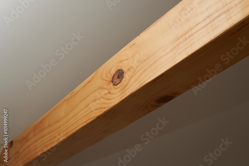 A round hole in a wooden beam