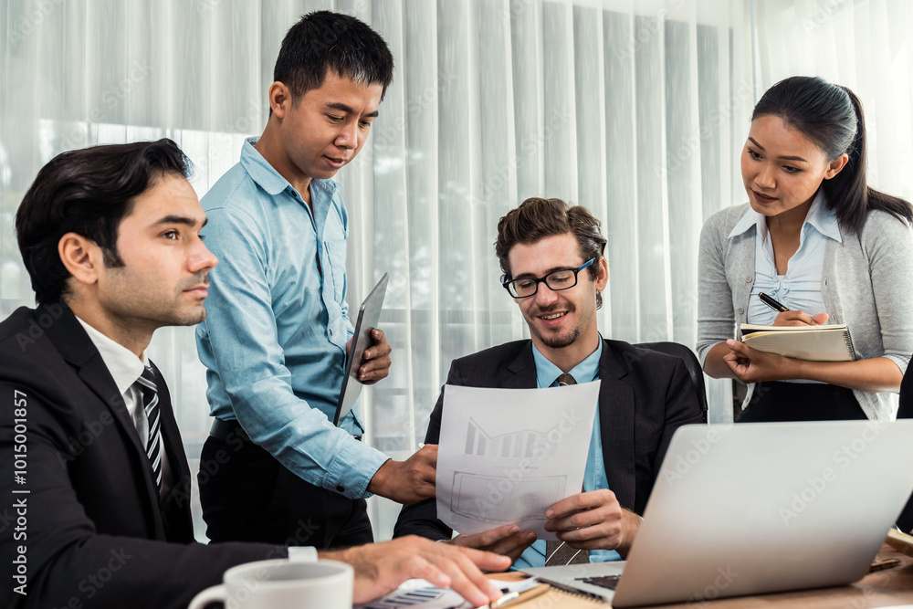 Diverse of business people from various ethnic group working in modern office environment. Productive and multi ethnic office workers engage in discussion for strategic business marketing. Meticulous Diverse of business people from various ethnic group working in modern office environment. Productive and multi ethnic office workers engage in discussion for strategic business marketing. Meticulous
