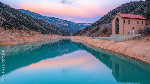 Serene Mountain Lake with Pink Sunset Reflection.