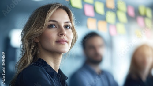 Thoughtful woman in a business meeting, engaging with colleagues and brainstorming ideas.